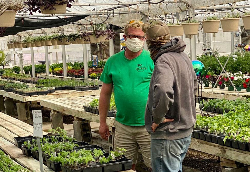 A Michigan greenhouse operator keeps business open, 'not afraid of